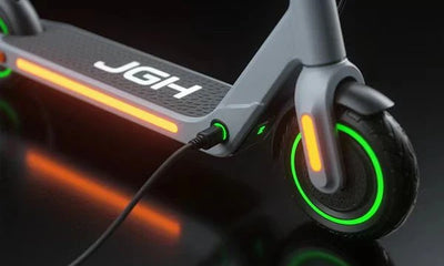 A JGH electric scooter that is charging