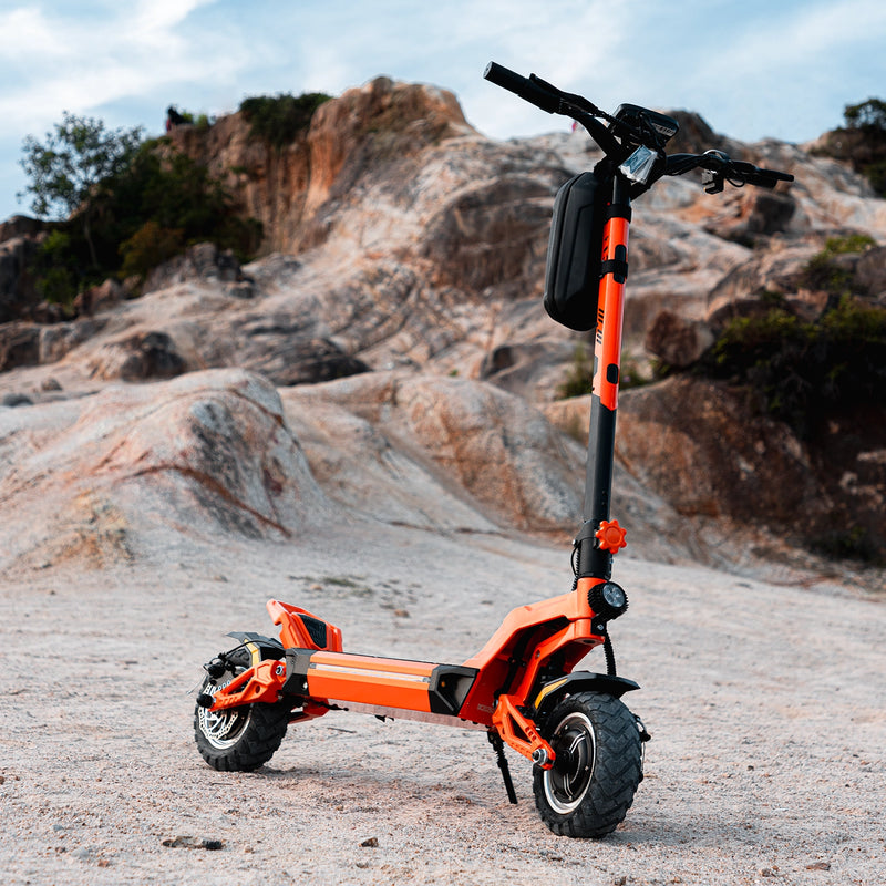 a JGH X5 Ultra electric scooter for adults parked on the sand